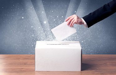 Ballot box with person casting vote