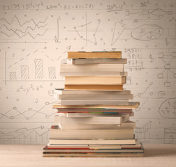 A pile of books with math formulas written in doodle style