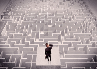 Businessman looking at labirynth from above