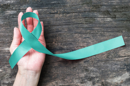 Teal ribbon awareness to support Ovarian/Cervical Cancer on hand support