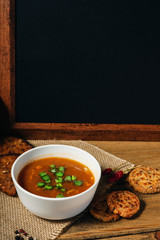 Goulash soup and wooden blackboard