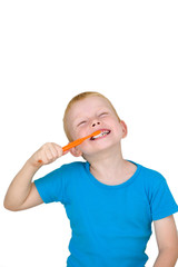 Boy brushing Teeth in front of White Background with Copy Space