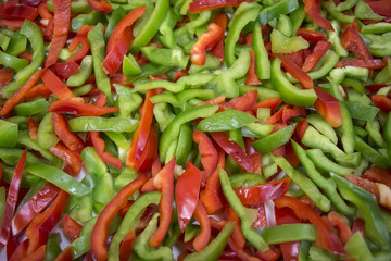 sliced green red bell pepper islolated on white cloth
