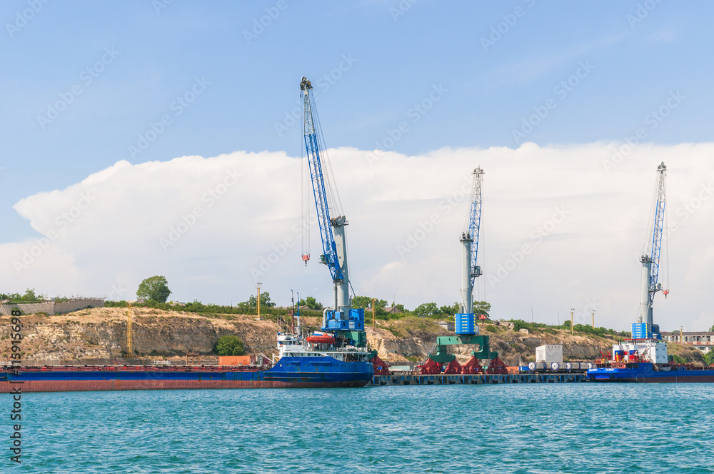 Wall mural cargo ship in industrial port