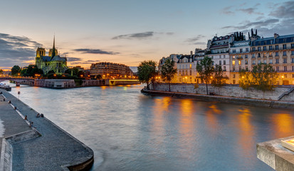 Beautiful evening in Paris with the Notre Dame Cathedral and the Ile de la Cite in the back