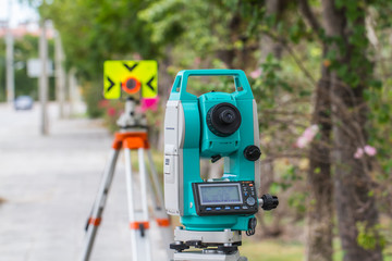 Surveyor equipment tacheometer or theodolite outdoors at construction site