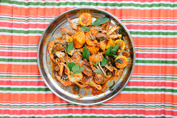 Fried shrimp ,squid and crab with basil with hot and spicy sour,