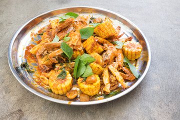 Fried shrimp ,squid and crab with basil with hot and spicy sour,