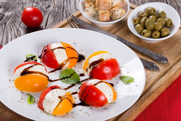 tomato. mozzarella, basil caprese summer salad, close-up