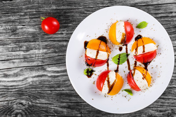 cherry tomatoes and mozarella cheese caprese salad, close-up