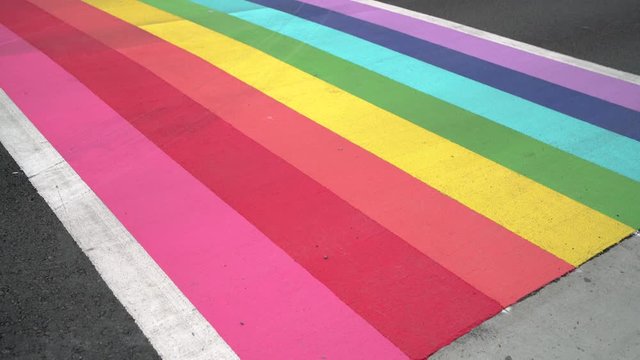 Pride Crosswalk Traffic, Vancouver 4K, UHD. Pedestrians and vehicles at the rainbow colored crosswalk in downtown Vancouver. Canada.

