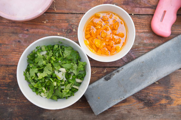 chopped green onion and yellow pickled-chilli mix with vinegar 