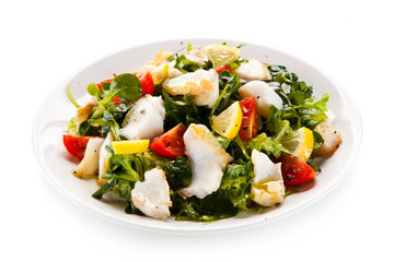 Fish salad - fried cod and vegetables 