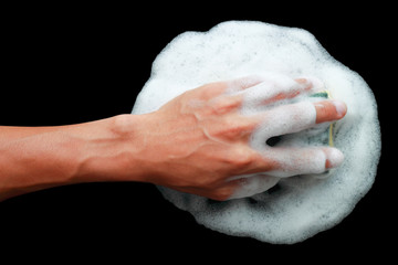 one hand holding sponge with foam for cleaning