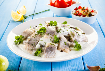 Marinated herring fillets in cream 