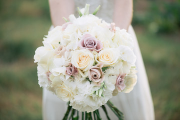 Bride holding wedding bouquet 