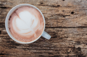 Hot coffee on wooden