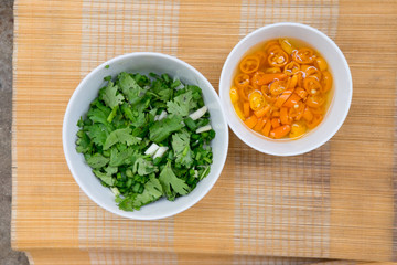 chopped green onion and yellow pickled-chilli mix with vinegar 