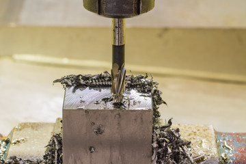 A CNC milling machine milling heads in metal industry