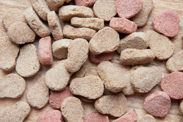 The image of dog food on a wooden table