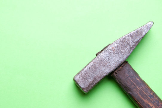 Small hammer on a green background