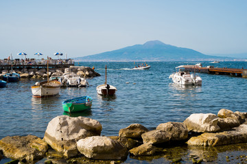 Fototapeta na wymiar View of the volcano Vesuvio from the harbor of Marina Grande