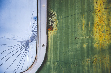 Broken window on old railroad wagon