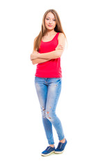 Young attractive woman in blue jeans isolated on white background. Beautiful girl model posing in the studio.