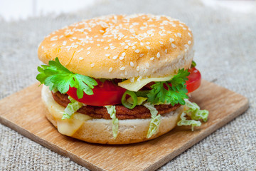 Homemade hamburger with fresh vegetables.