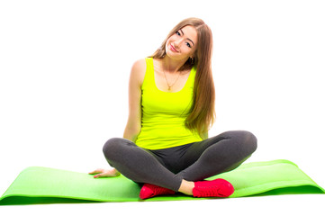 Young smiling woman in sportswear doing yoga stretching, isolated on white background.