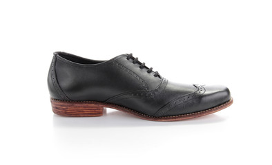 Side detail of black leather shoes isolated