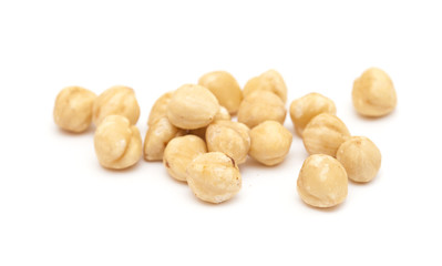 Fototapeta na wymiar handful of shelled hazelnuts isolated on white