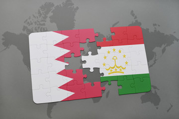 puzzle with the national flag of bahrain and tajikistan on a world map background.
