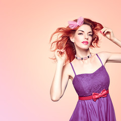 Fashion. Redhead Model woman, Natural fashion makeup. Beauty portrait sexy girl in red Fashion dress. Shiny wavy Hairstyle, fashion Makeup, Eyelashes. Skincare Spa, fashion concept. Creative unusual