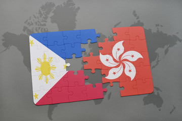 puzzle with the national flag of philippines and hong kong on a world map background.