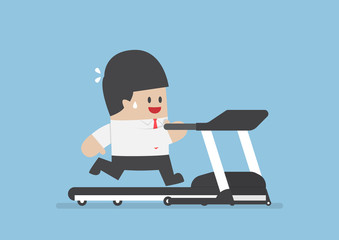 Businessman running on treadmill