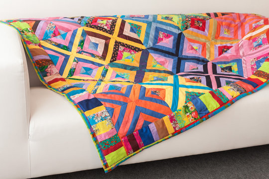 Multicoloured Patchwork quilt. Part of patchwork quilt as background.