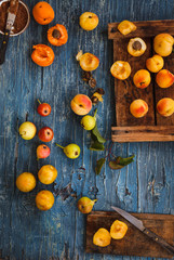 Summer fruits composition arranged on a old blue wooden tabletop. 