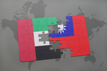 puzzle with the national flag of united arab emirates and taiwan on a world map background.