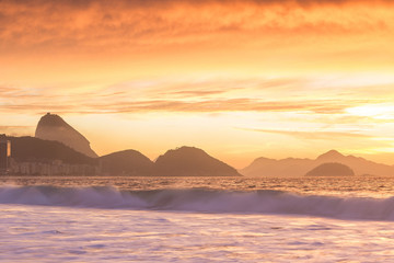 Fototapeta na wymiar Sunrise view of Copacabana and mountain Sugar Loaf in Rio de Jan