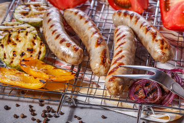 Cooked sausages on the grill grate.