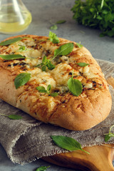 Focaccia with onions, herbs and cheese.
