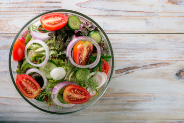 vegetable salad on a wooden background