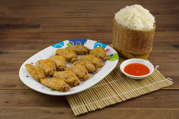 Fried chicken wings with hot sauce