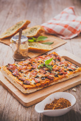 Homemade bacon pizza with garlic bread