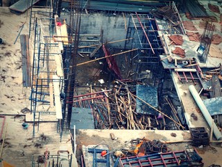 Unsafety Construction Site. The worker is working in construction site without proper safety equipment.