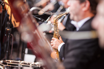 Playing a saxophone. Sound orchestra close up. Saxophone close up © melnikofd
