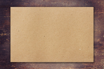 brown paper on wood background with space