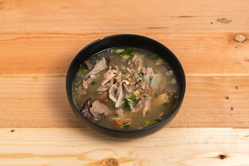 Pork Spare Ribs Rice Noodles Soup on wood background
