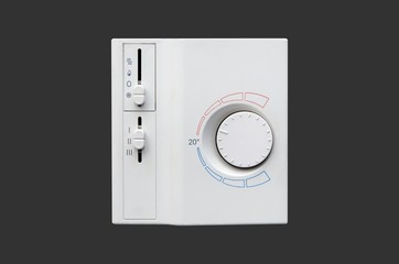 Air conditioner thermostat panel isolated on dark background
